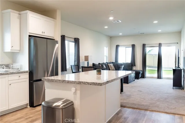 a stove top oven sitting inside of a kitchen