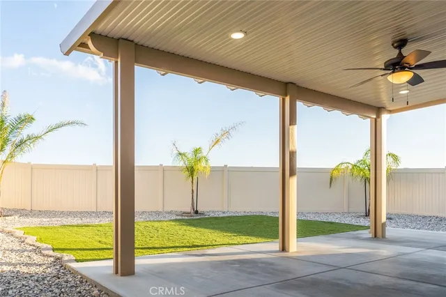 a view of a swimming pool with a table and chairs
