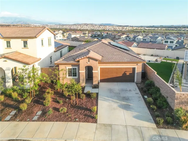 an aerial view of a house with swimming pool