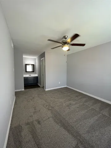 a view of a livingroom with a ceiling fan