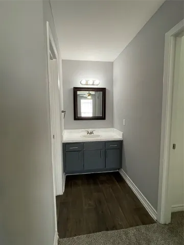 a bathroom with a sink a mirror and a bathtub