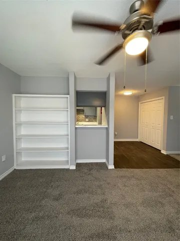 a view of an empty room and a windows