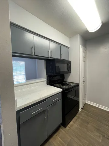a kitchen with a stove and a refrigerator