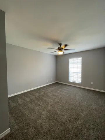 an empty room with a empty space and a window