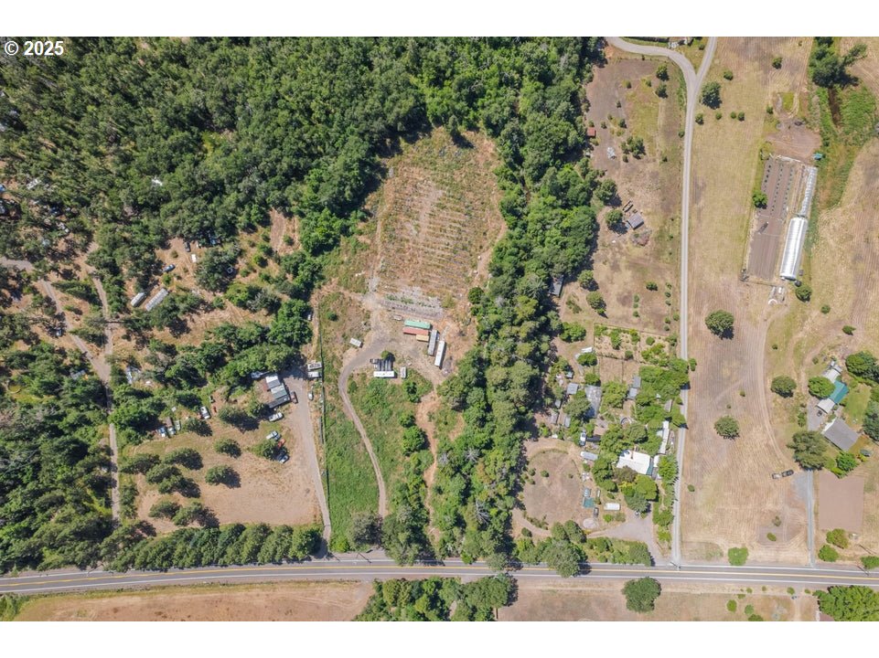 7902 Takilma Road Cave Junction, OR 97523 - Photo 2 of 3 a view of a garden