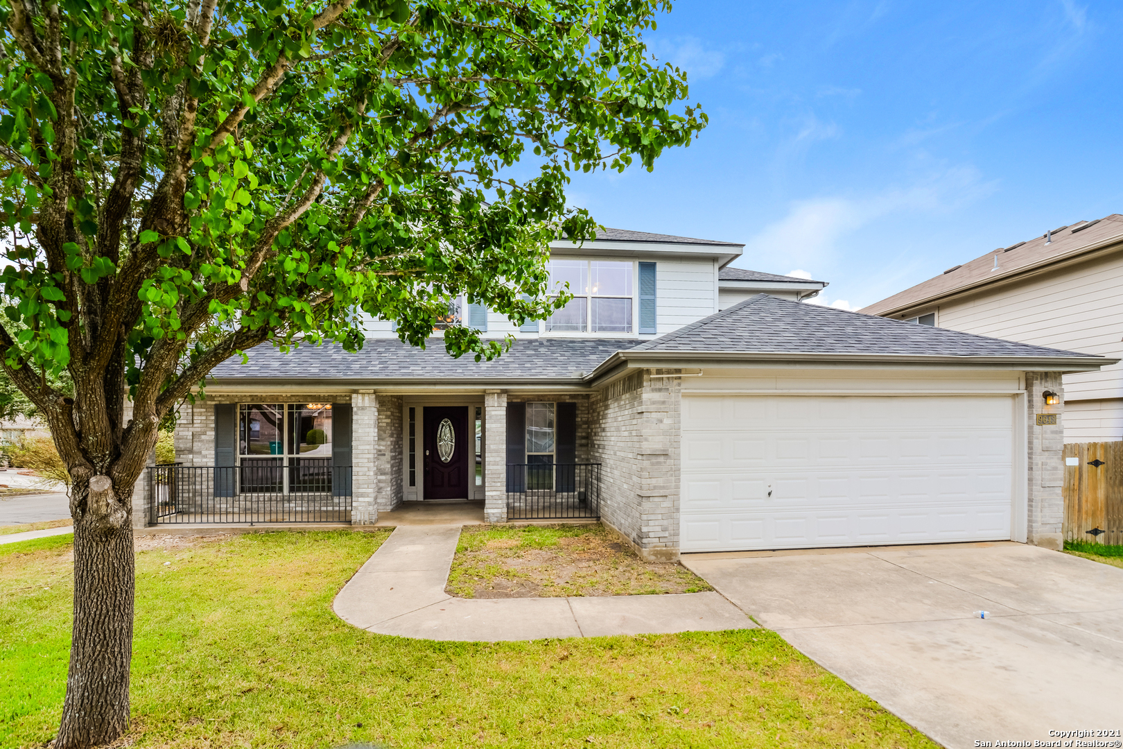 front view of a house with a yard