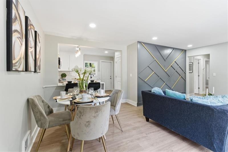 4015 Moffat Court Decatur, GA 30035 - Photo 12 of 34 a view of a dining room with furniture and wooden floor
