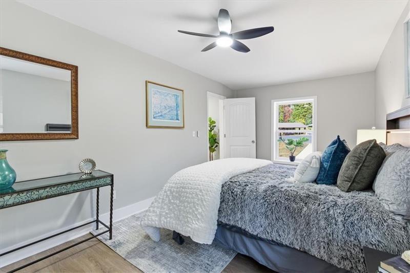 4015 Moffat Court Decatur, GA 30035 - Photo 15 of 34 a bedroom with a large bed and a window