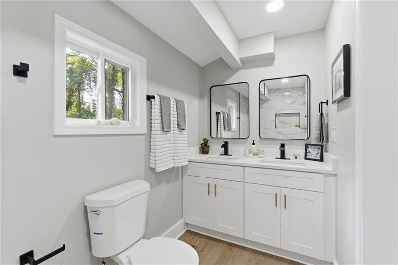4015 Moffat Court Decatur, GA 30035 - Photo 17 of 34 a bathroom with a toilet sink and mirror