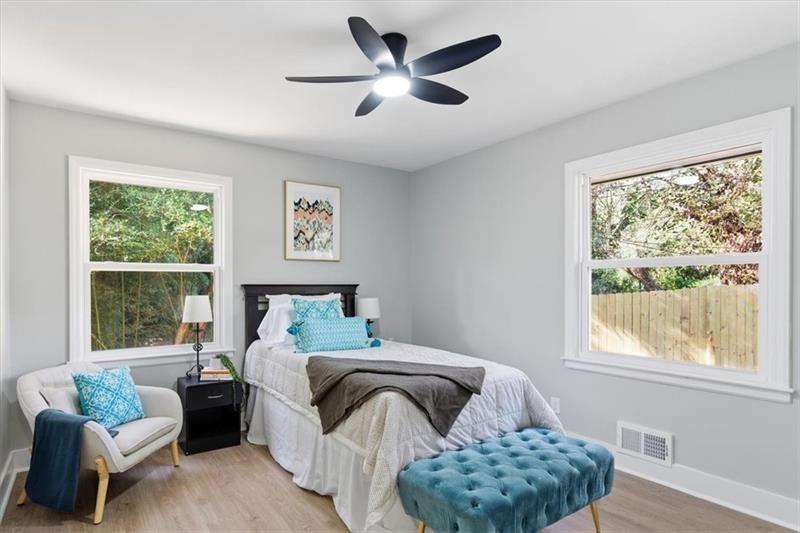 4015 Moffat Court Decatur, GA 30035 - Photo 19 of 34 a bedroom with bed couch and window
