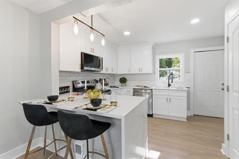 4015 Moffat Court Decatur, GA 30035 - Photo 7 of 34 a kitchen with a sink cabinets and window