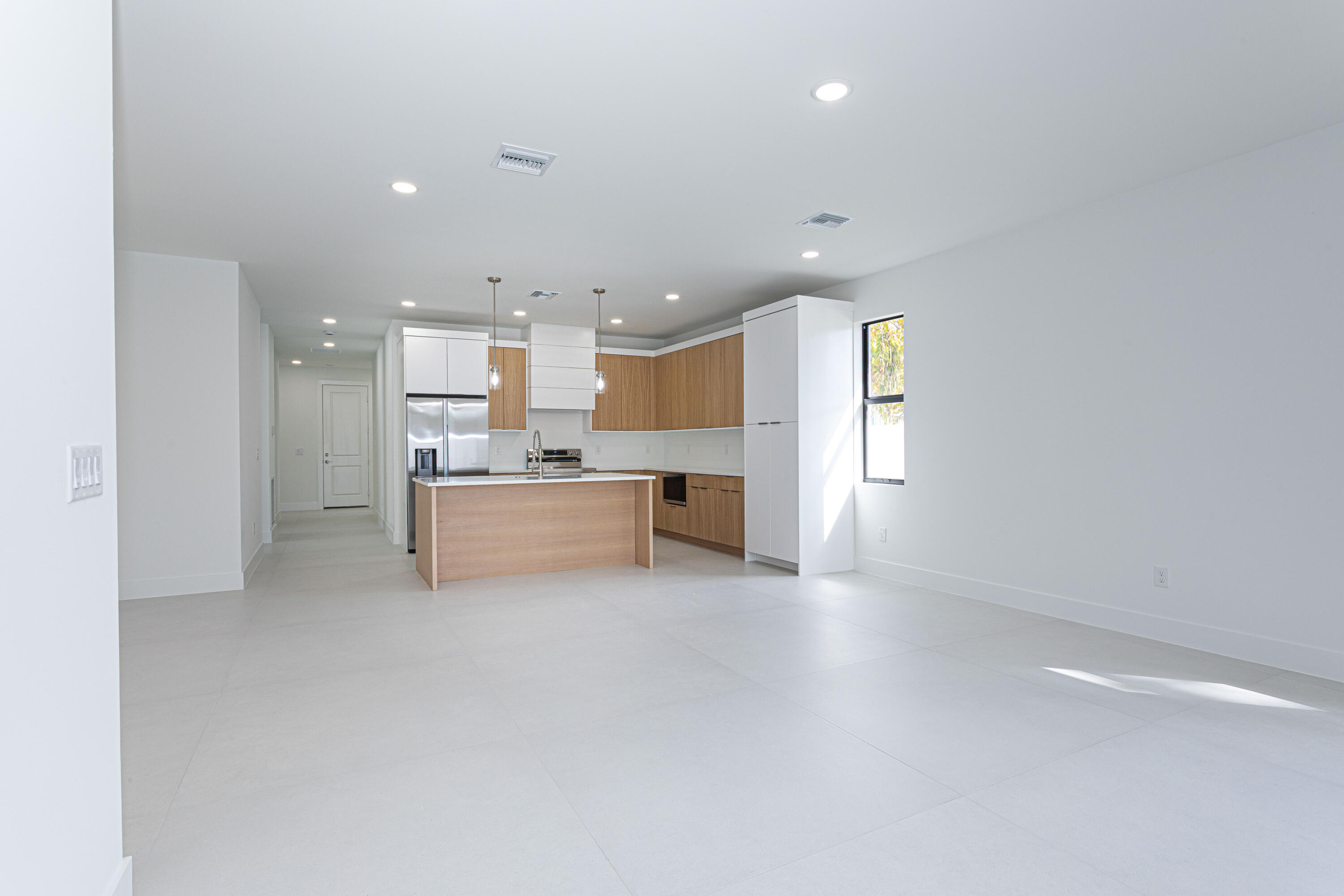 308 4th Street Jupiter, FL 33458 - Photo 14 of 51 a view of a kitchen with a sink and cabinets
