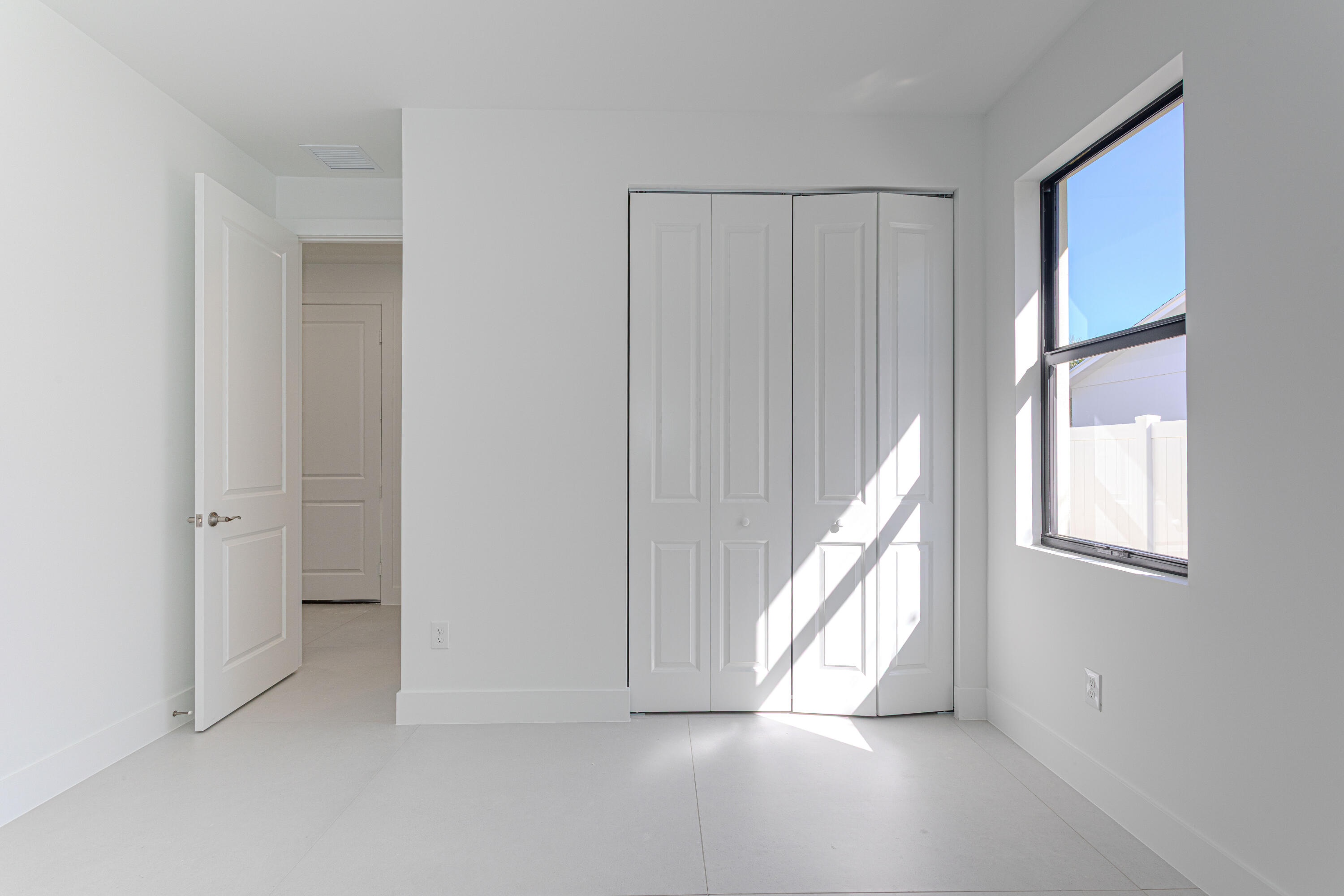 308 4th Street Jupiter, FL 33458 - Photo 17 of 51 a view of an empty room with a window