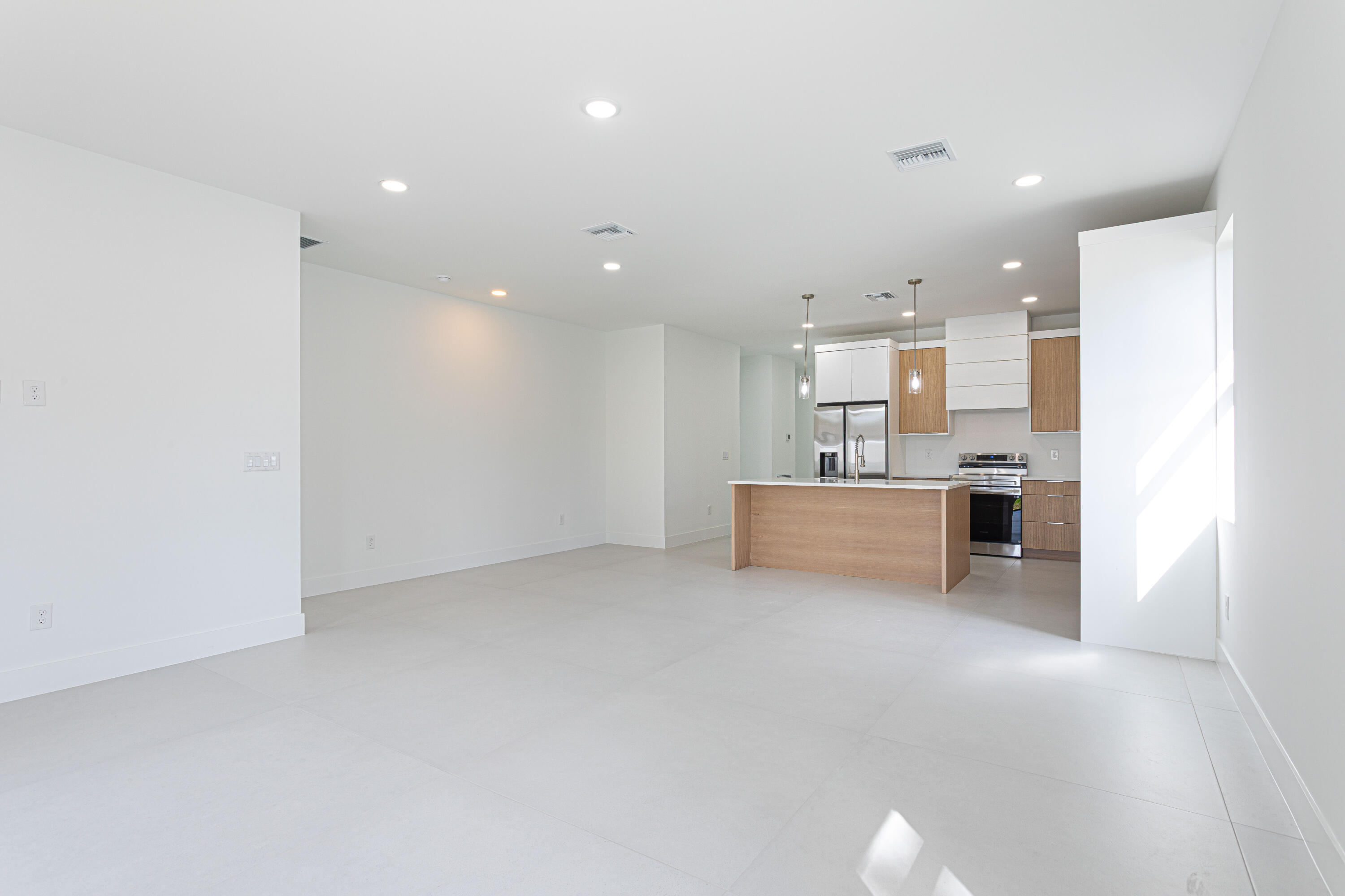 308 4th Street Jupiter, FL 33458 - Photo 19 of 51 a view of a kitchen with a sink and a refrigerator