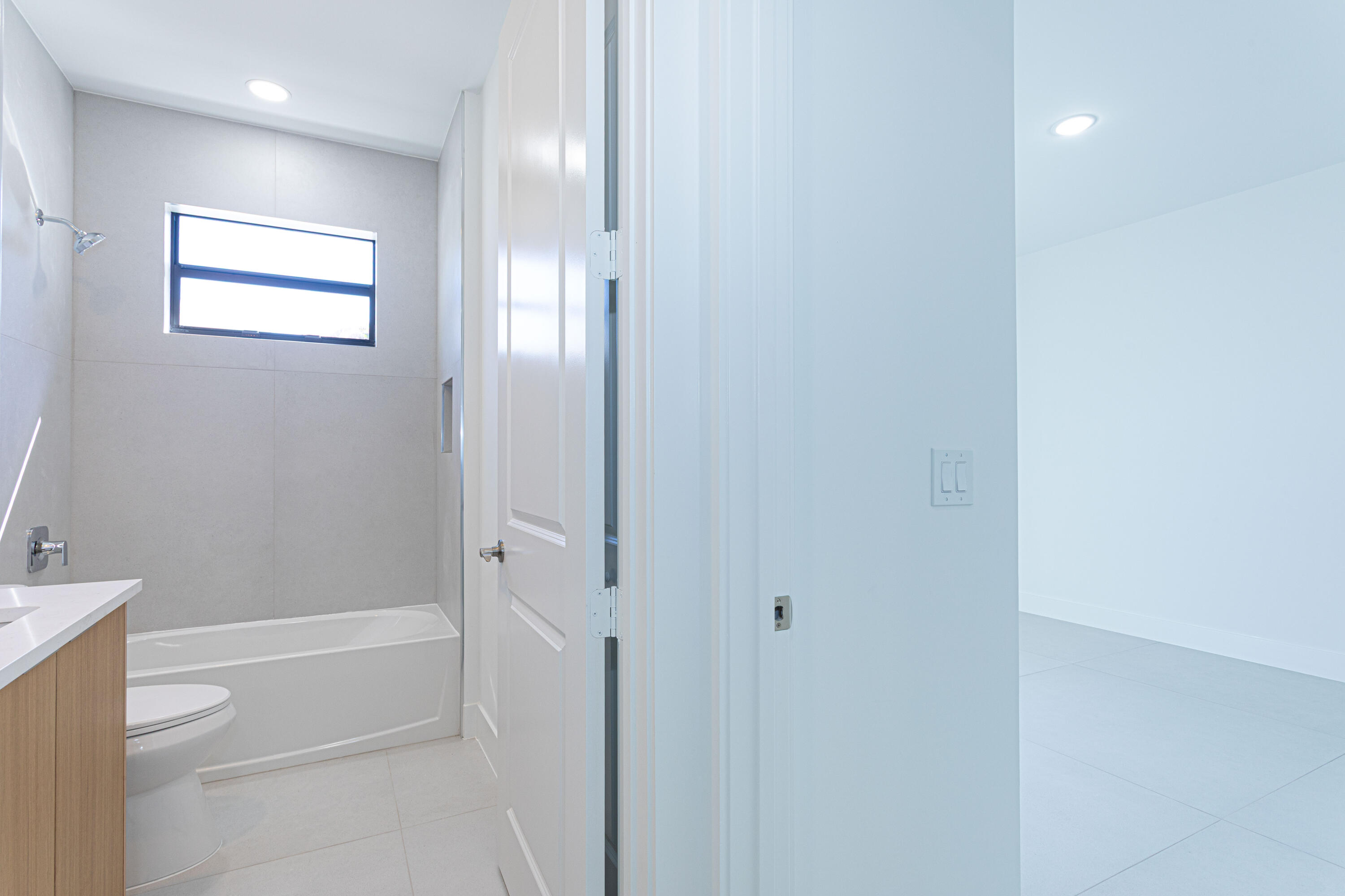 308 4th Street Jupiter, FL 33458 - Photo 22 of 51 a bathroom with a bathtub and a shower