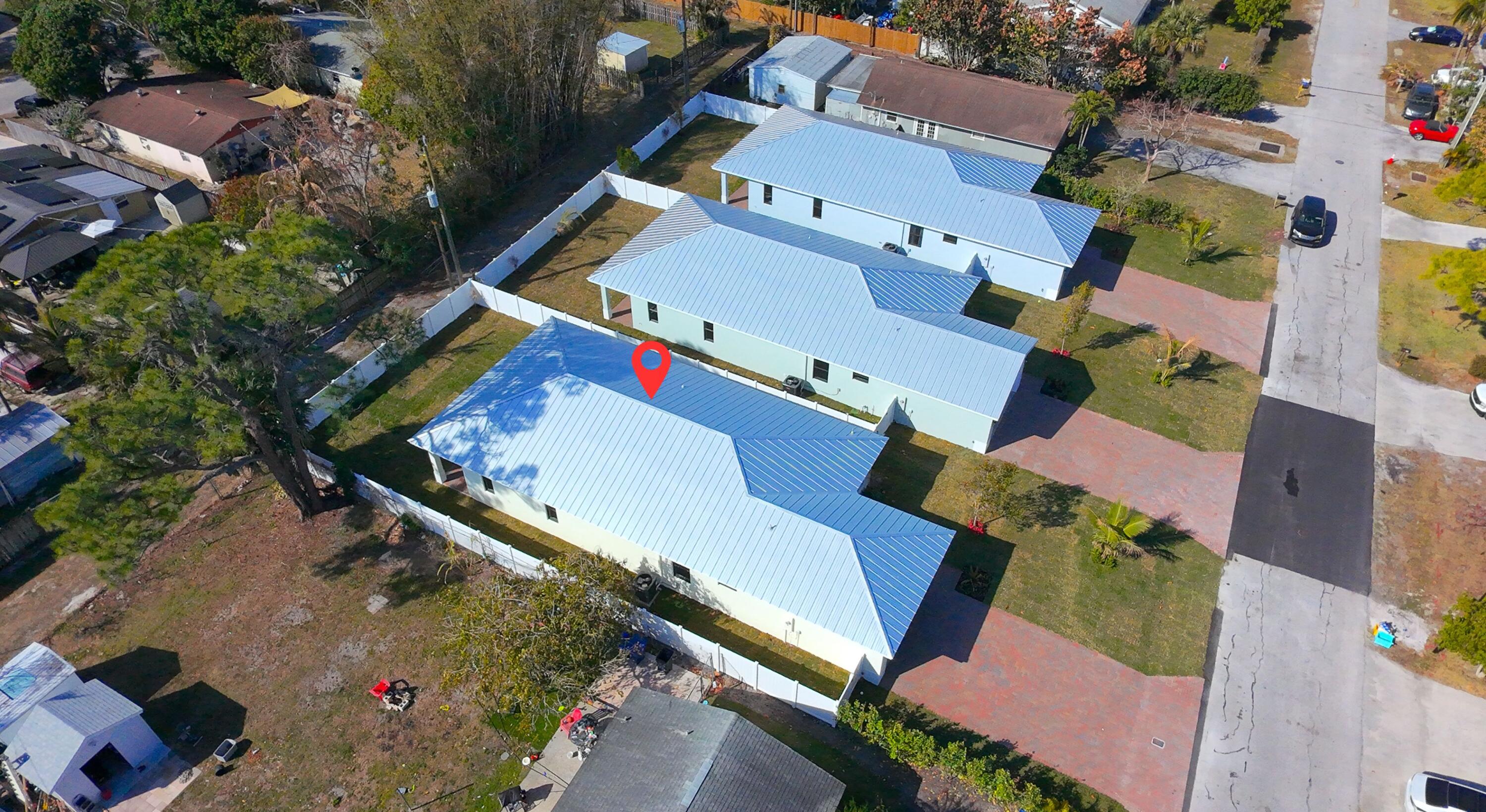 308 4th Street Jupiter, FL 33458 - Photo 34 of 51 an aerial view of a house with a yard
