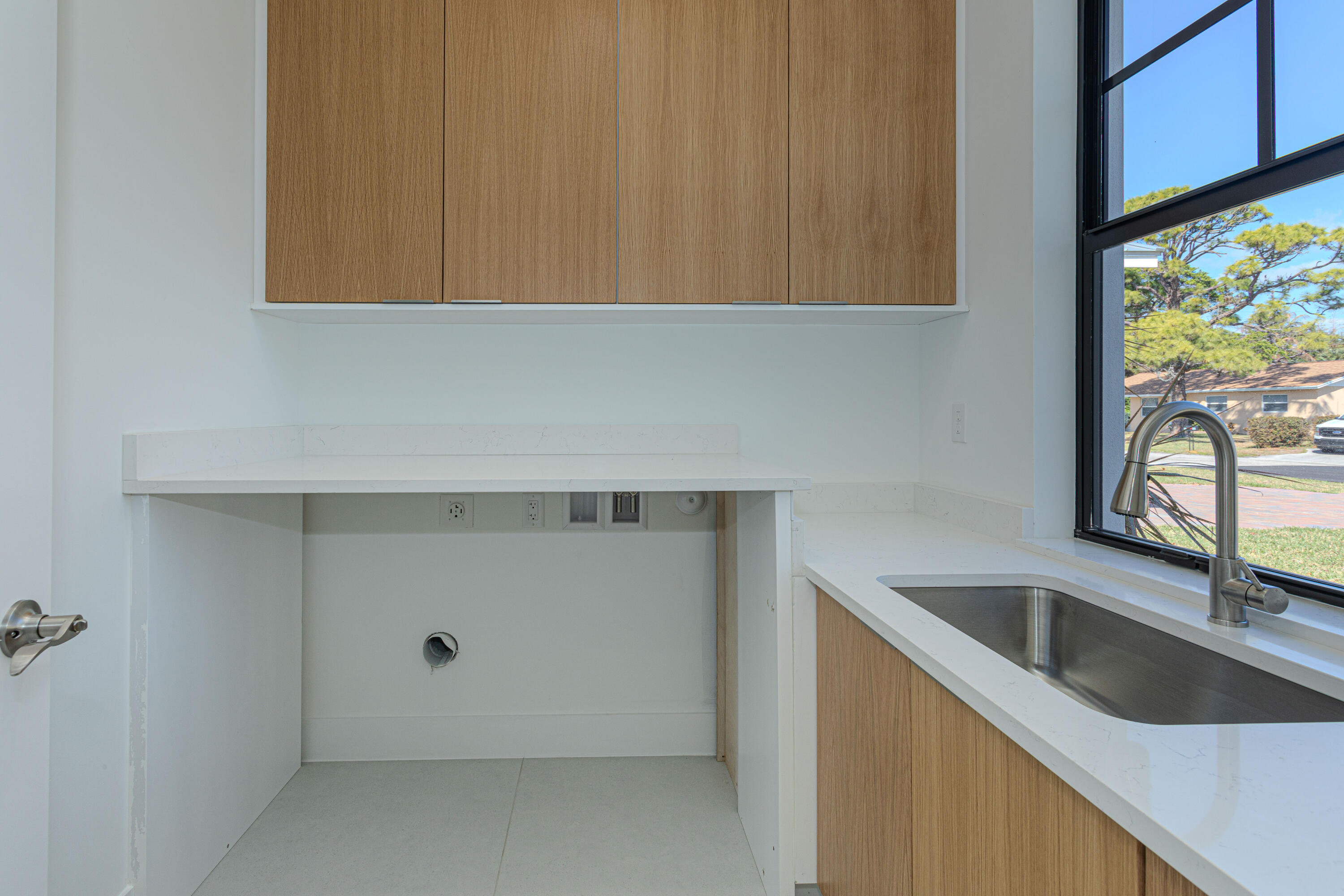 308 4th Street Jupiter, FL 33458 - Photo 35 of 51 a kitchen with a sink and cabinets