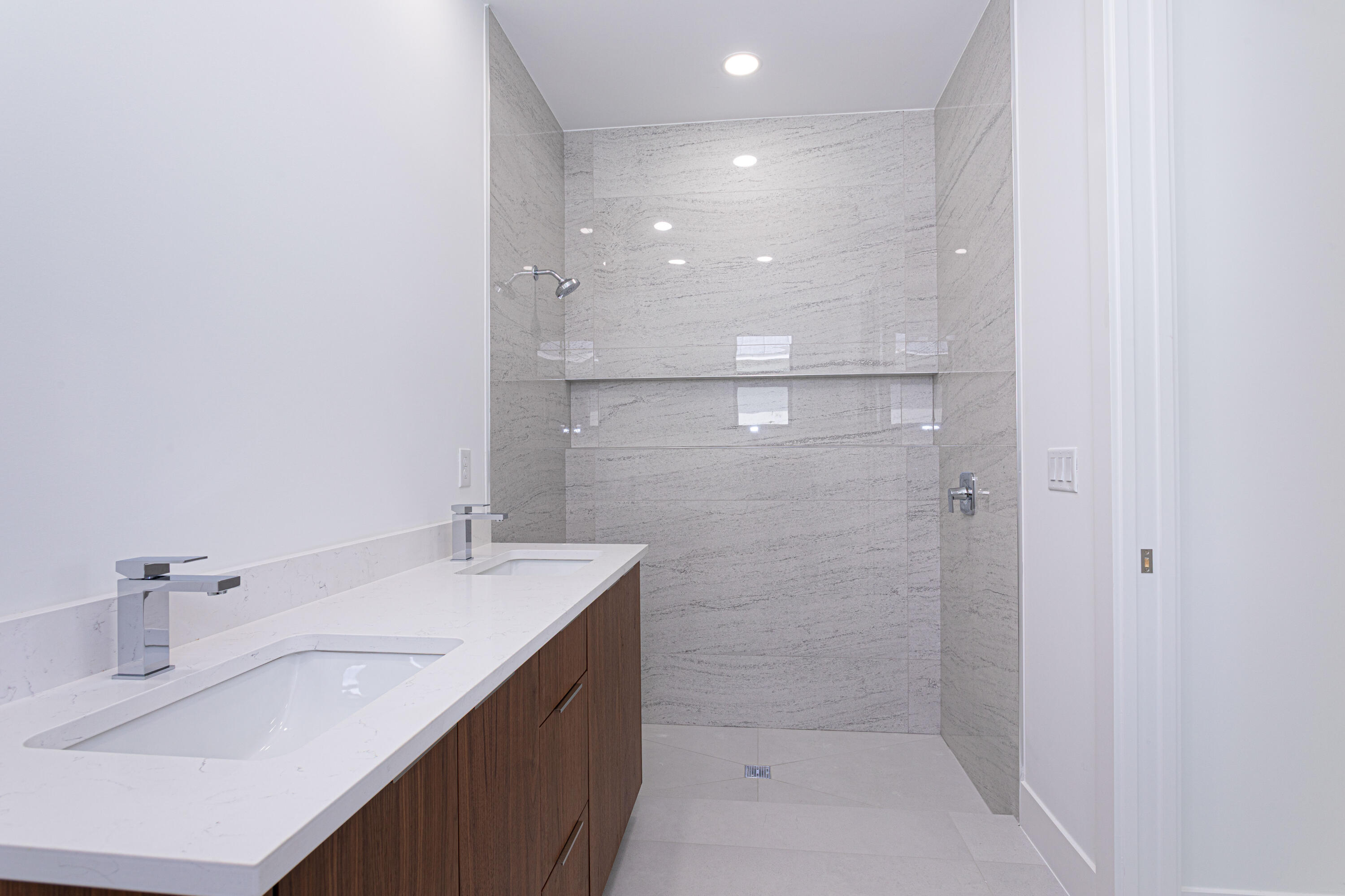 308 4th Street Jupiter, FL 33458 - Photo 42 of 51 a bathroom with a sink a shower and a mirror