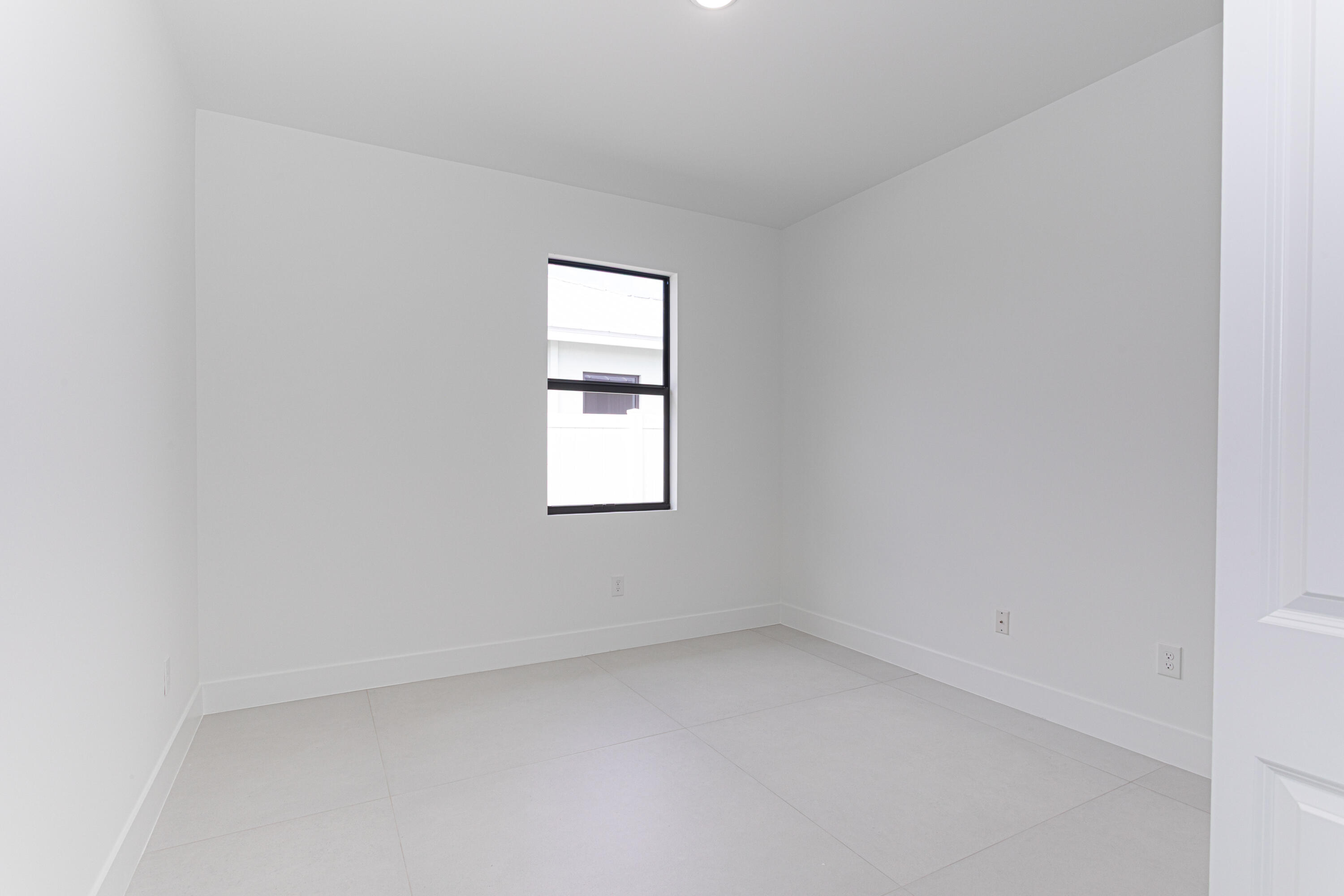 308 4th Street Jupiter, FL 33458 - Photo 8 of 51 an empty room with a window