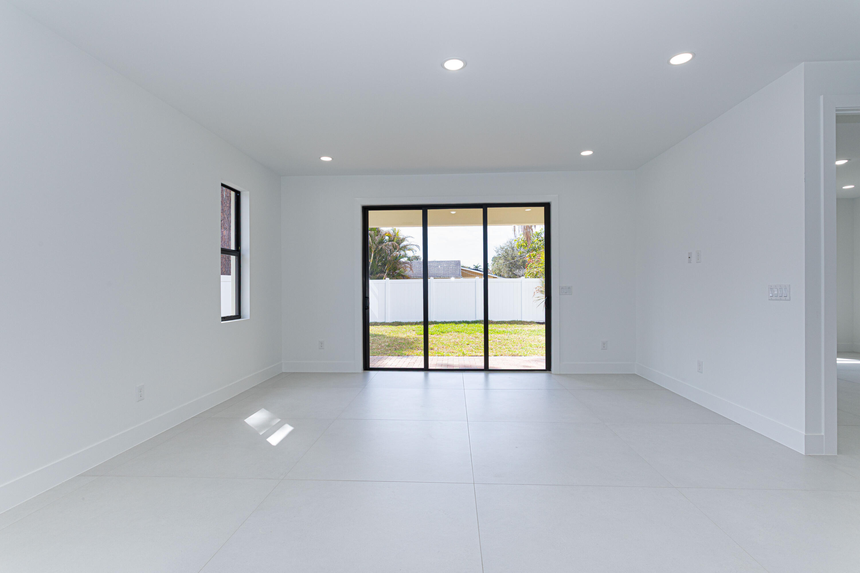 308 4th Street Jupiter, FL 33458 - Photo 9 of 51 en view of an empty room with a window