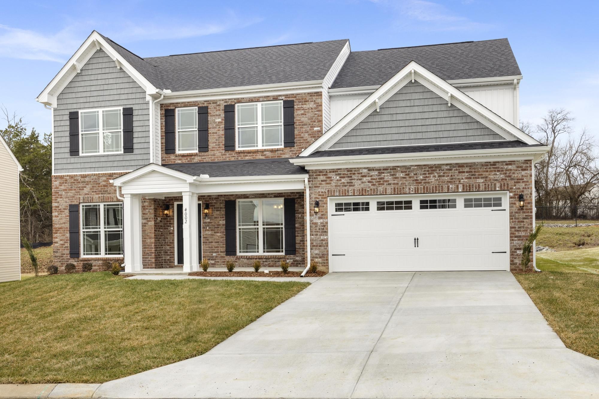 front view of a house with a yard