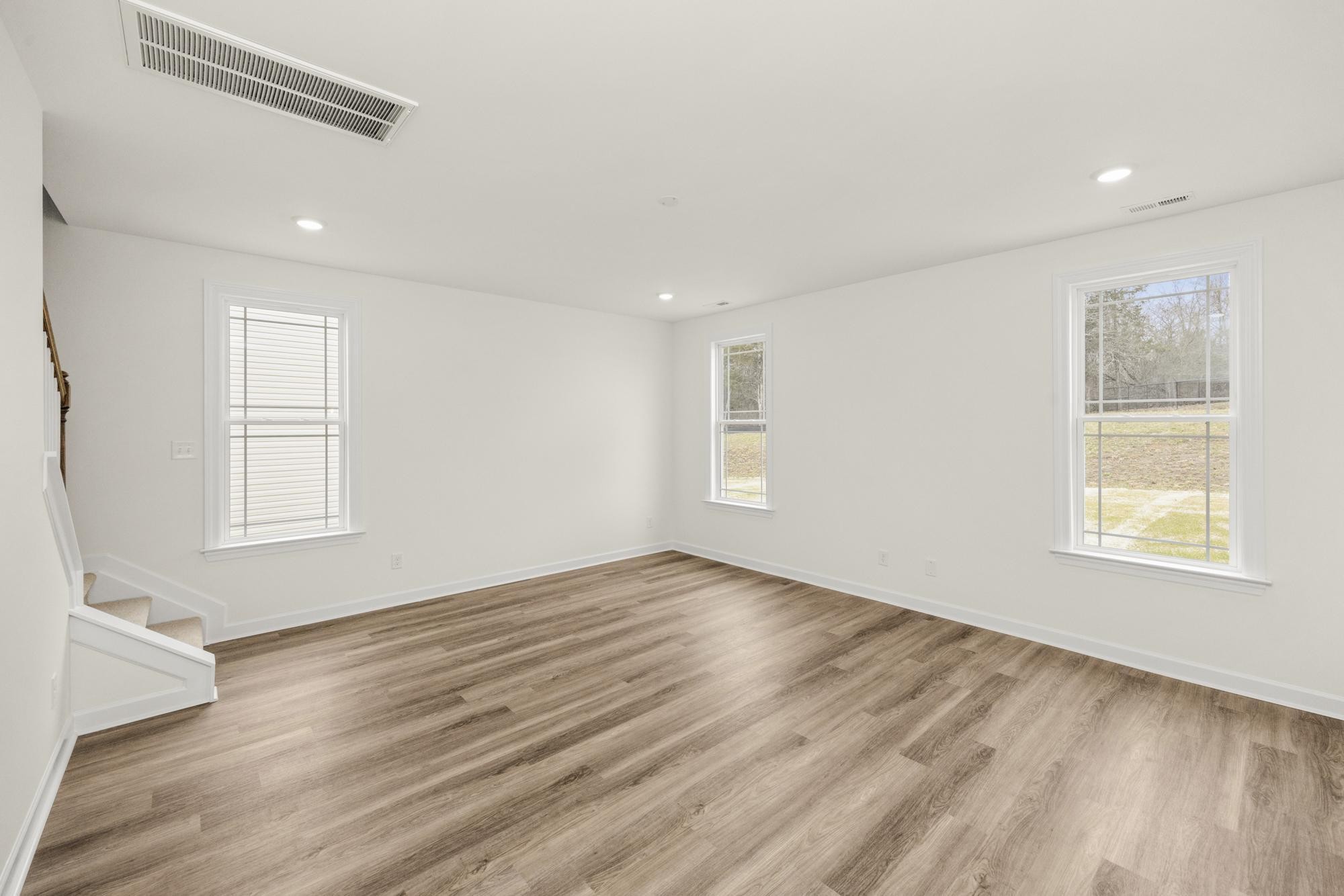 4002 Rampart Way Spring Hill Spring Hill, TN 37174 - Photo 14 of 42 a view of an empty room with wooden floor and a window