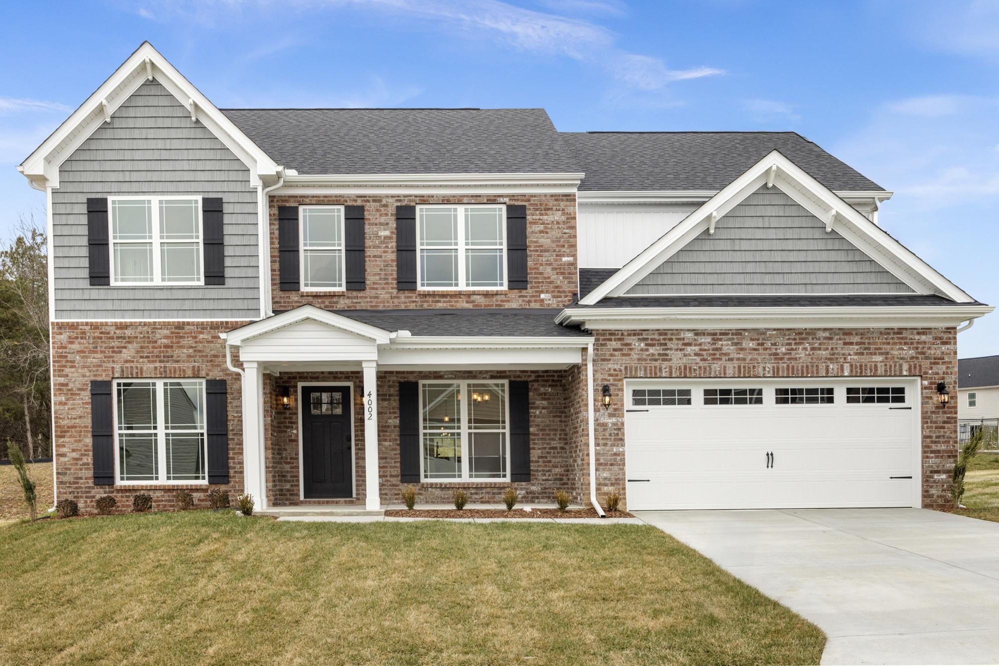 4002 Rampart Way Spring Hill Spring Hill, TN 37174 - Photo 2 of 42 a front view of a house with a yard