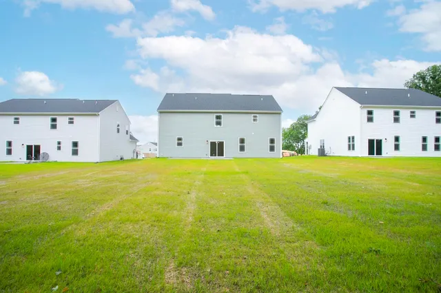 a house view with swimming pool in front of it