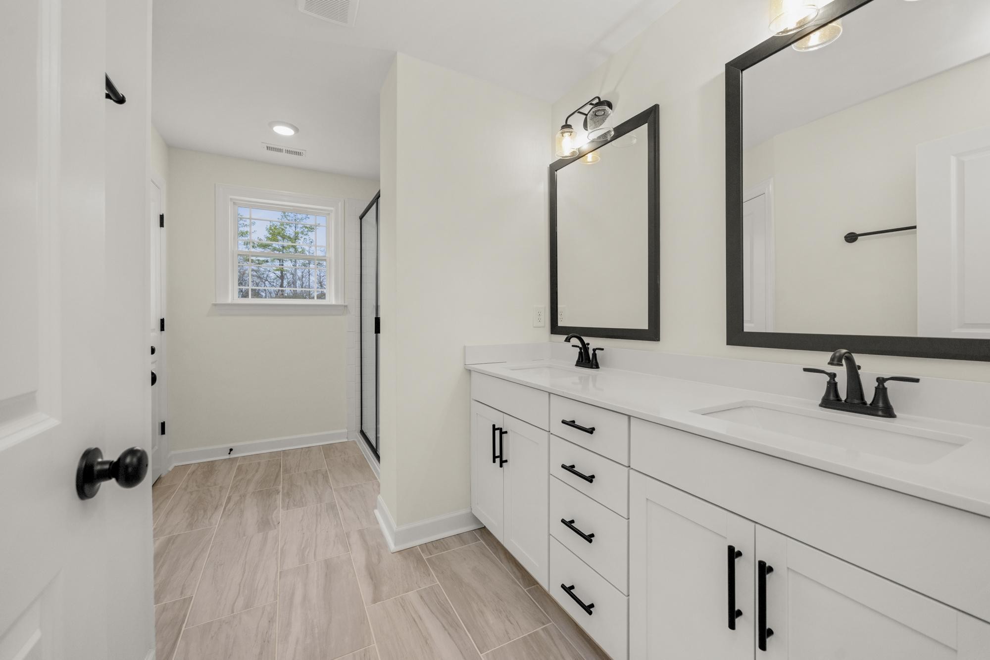4002 Rampart Way Spring Hill Spring Hill, TN 37174 - Photo 37 of 42 a bathroom with a double vanity sink and mirror
