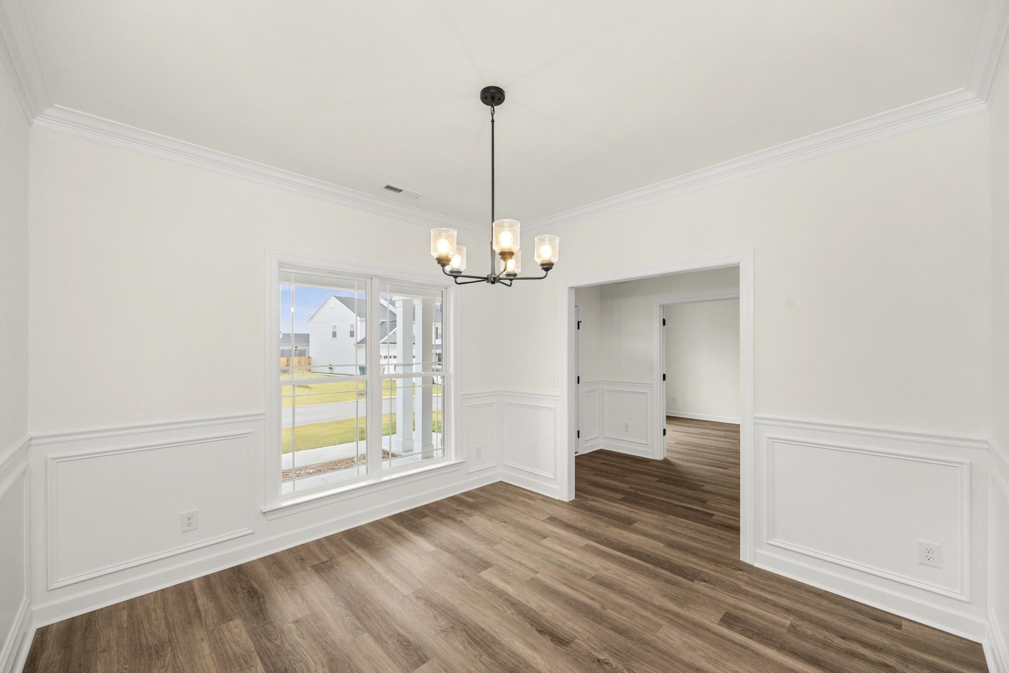 4002 Rampart Way Spring Hill Spring Hill, TN 37174 - Photo 7 of 42 a view of an empty room with window and wooden floor