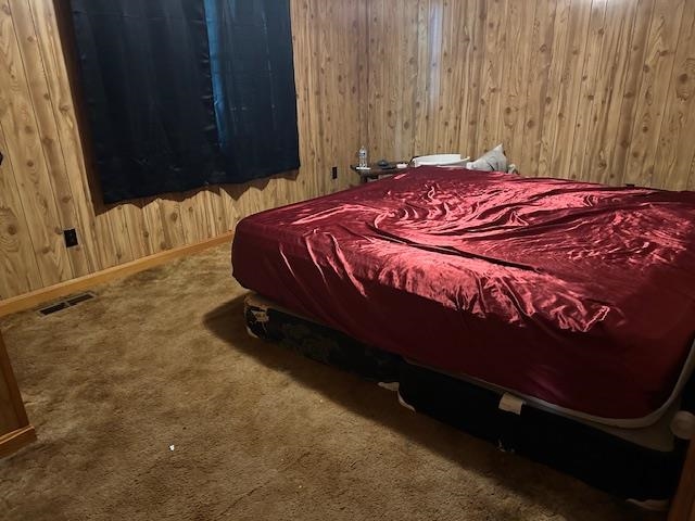 420 G B Plunk Road Selmer, TN 38375 - Photo 11 of 26 Carpeted bedroom with wooden walls