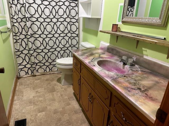 420 G B Plunk Road Selmer, TN 38375 - Photo 12 of 26 Bathroom with tile patterned floors, vanity, and toilet