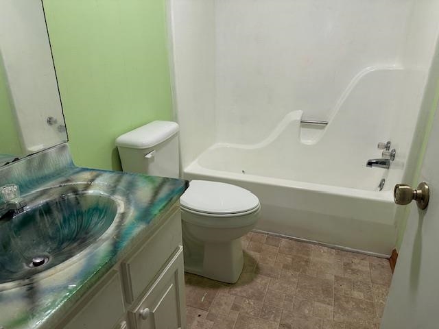420 G B Plunk Road Selmer, TN 38375 - Photo 15 of 26 Full bathroom with shower / bathtub combination, vanity, tile patterned floors, and toilet