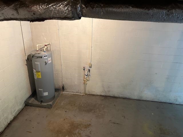 420 G B Plunk Road Selmer, TN 38375 - Photo 21 of 26 Basement featuring electric water heater