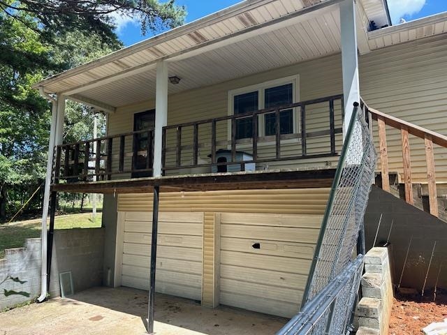 420 G B Plunk Road Selmer, TN 38375 - Photo 22 of 26 View of home's exterior featuring a porch and a garage