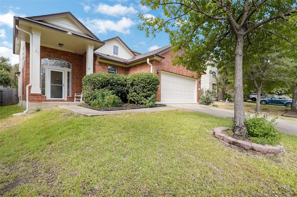 a front view of a house with garden