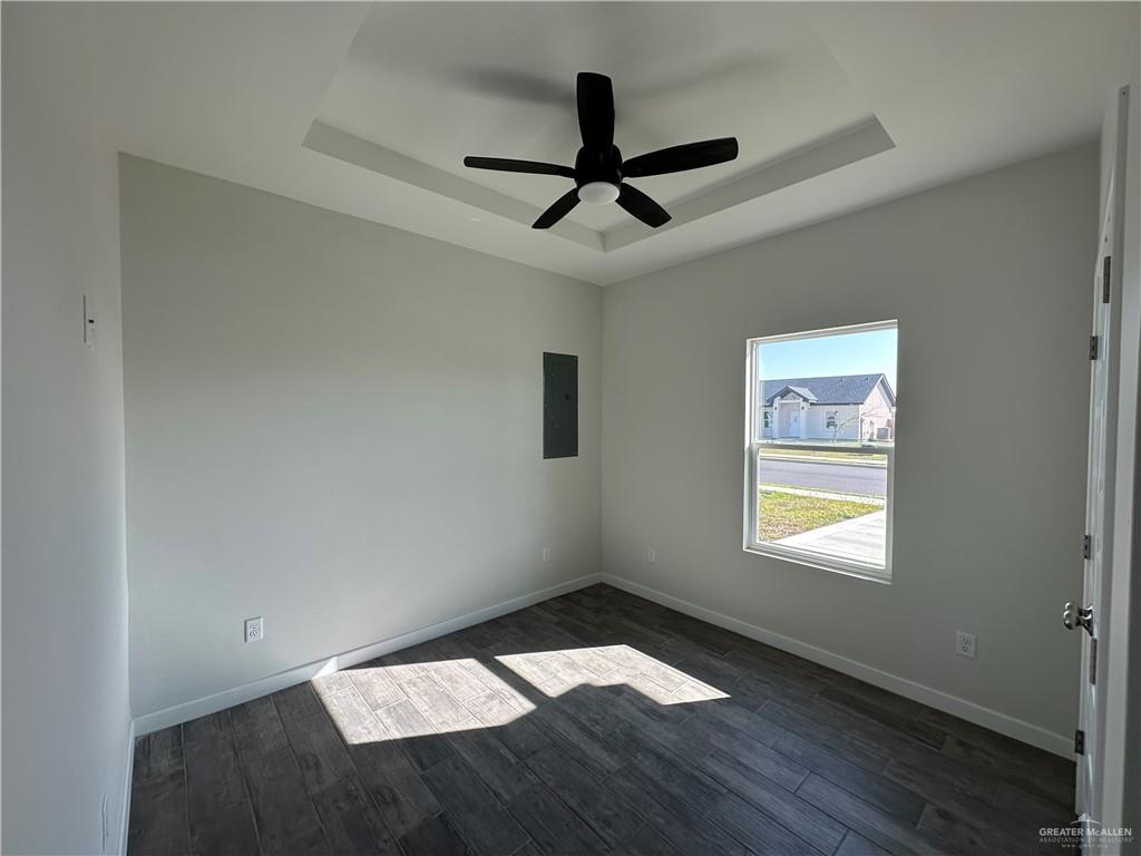 1805 Unity Drive Mercedes, TX 78570 - Photo 5 of 10 a view of empty room with wooden floor and fan