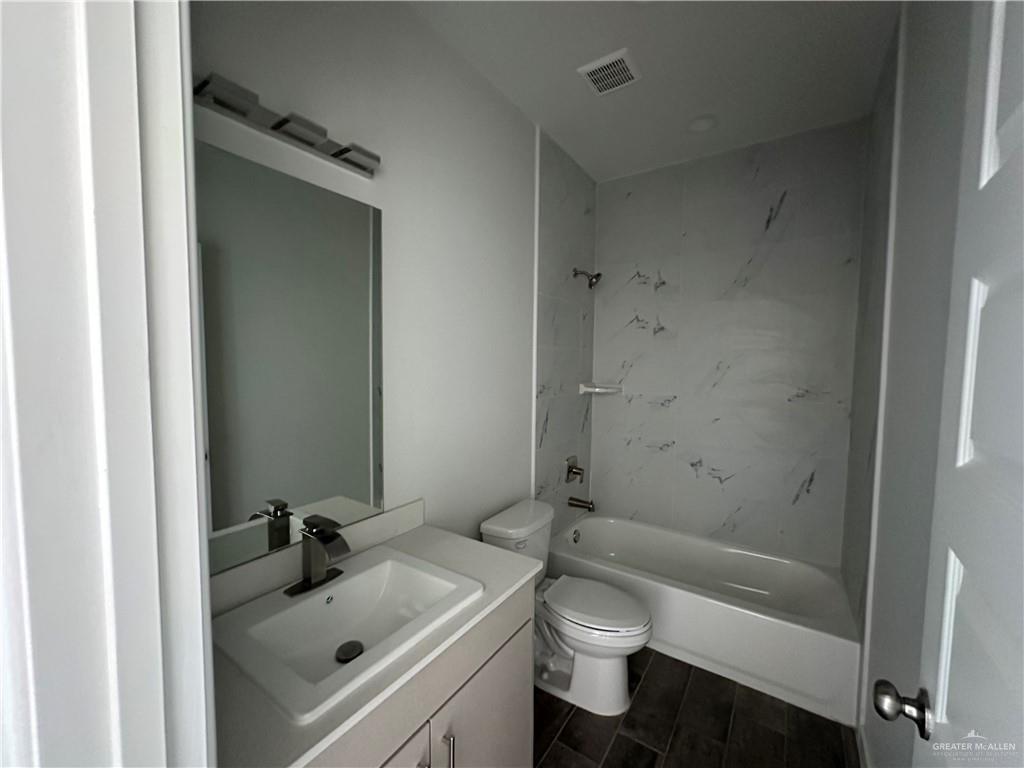1805 Unity Drive Mercedes, TX 78570 - Photo 8 of 10 a bathroom with a sink toilet and shower