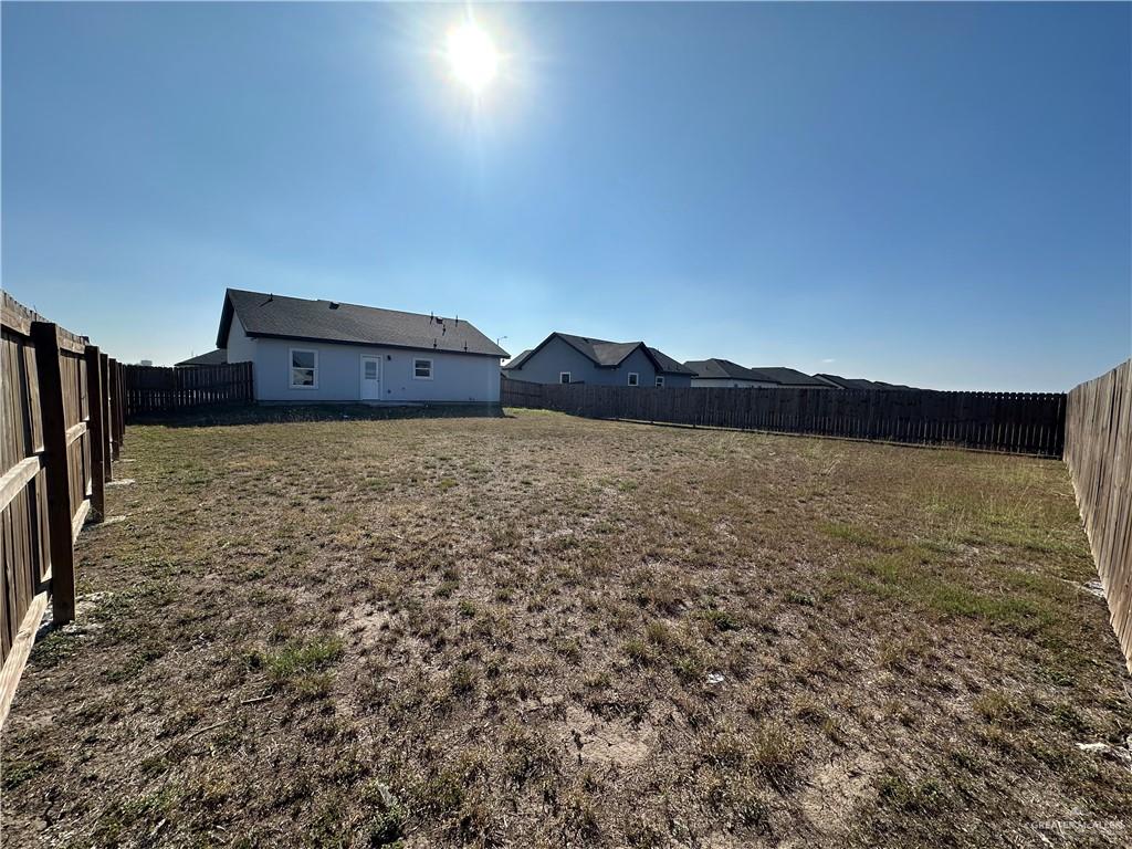 1805 Unity Drive Mercedes, TX 78570 - Photo 10 of 10 a view of a field with an ocean in the background