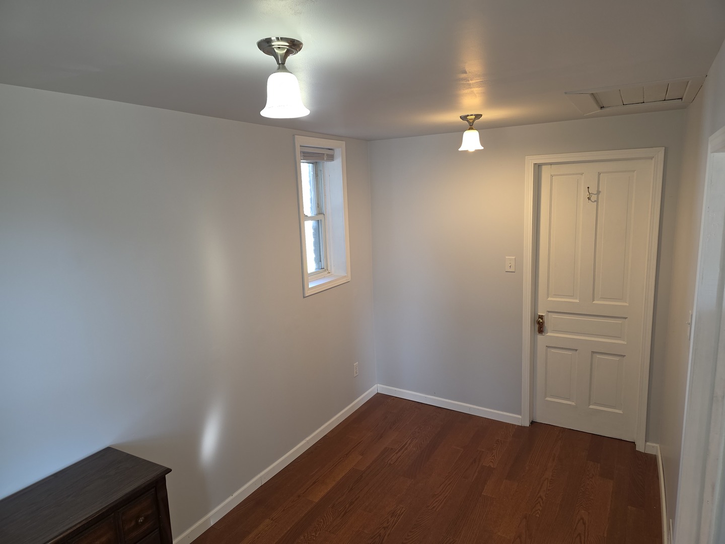 725 Chase Avenue Joliet, IL 60432 - Photo 5 of 15 wooden floor in an empty room with a window