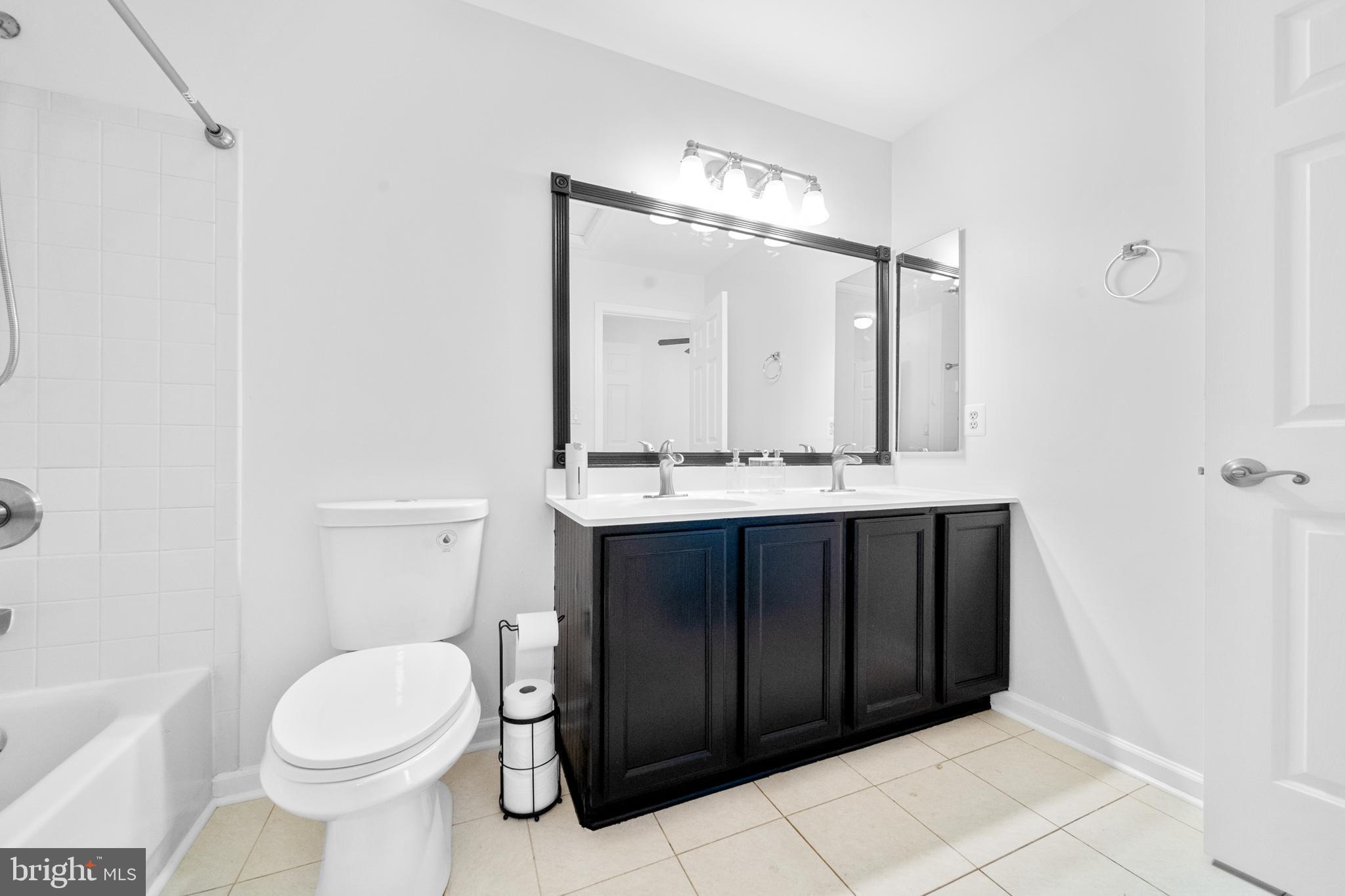 8596 Cold Harbor Loop Manassas, VA 20111 - Photo 27 of 52 a bathroom with a sink vanity mirror and toilet