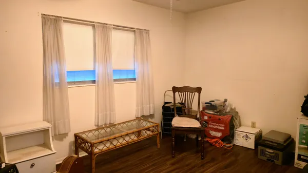 a view of a wooden door and a window