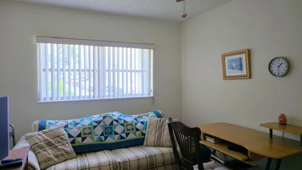 a view of a workspace with furniture