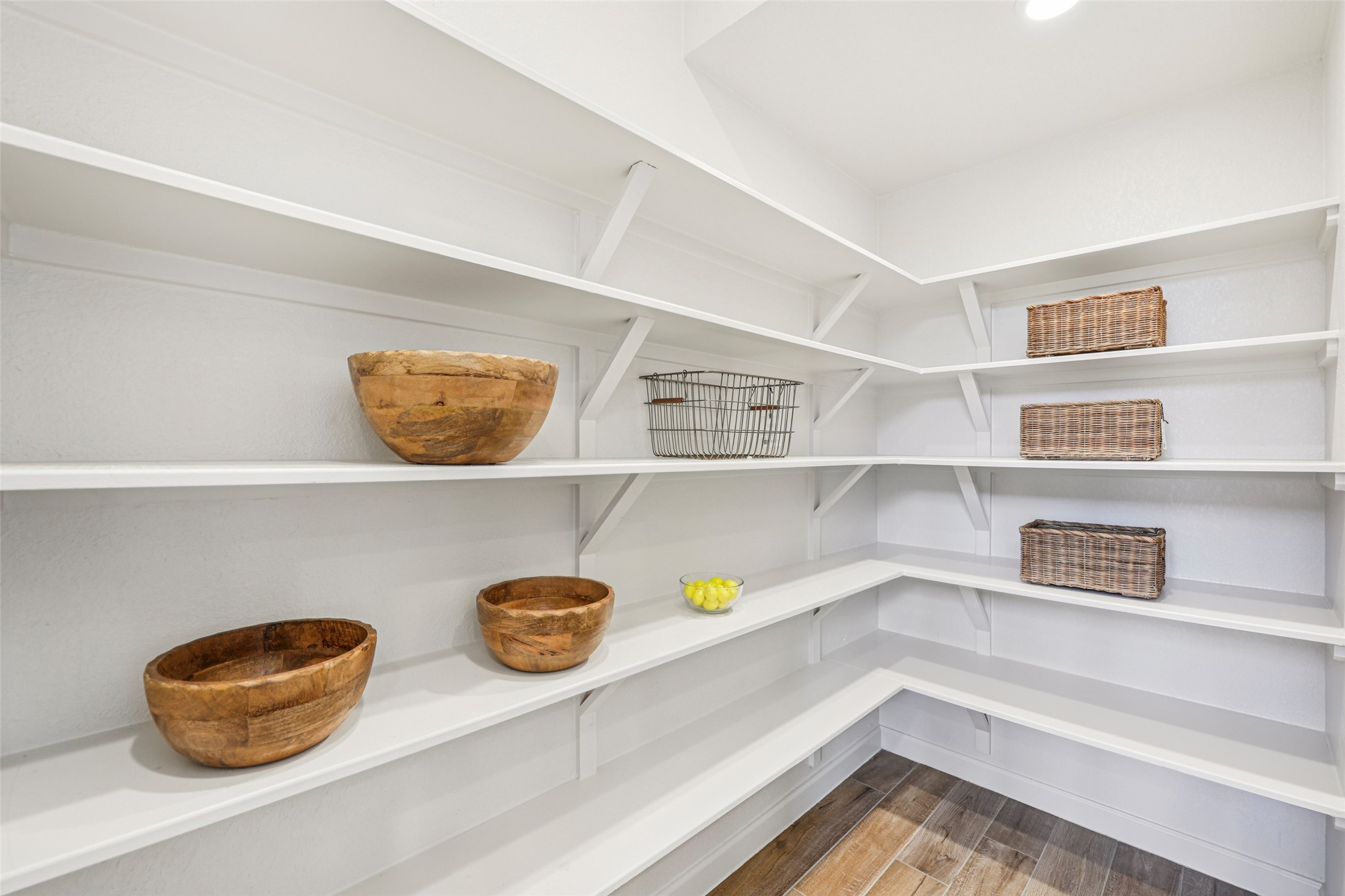 1140 Bryson Rdg Trail Leander, TX 78641 - Photo 11 of 39 The pantry features extensive white shelving, a light-colored floor, and recessed lighting