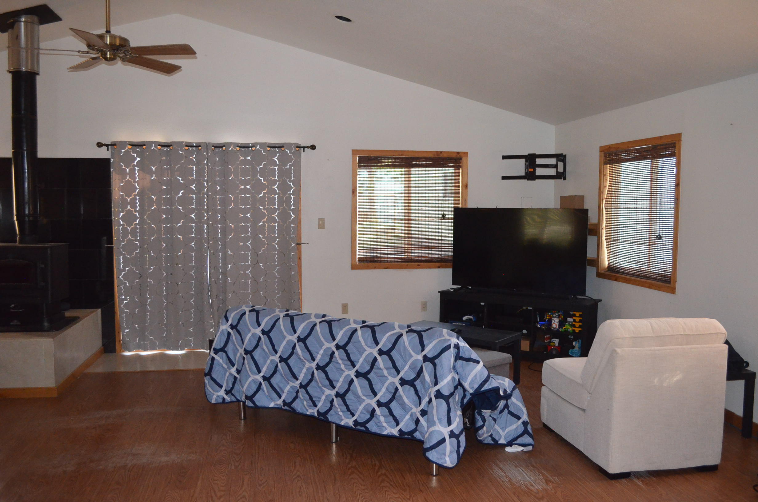 132860 Highway 97 Crescent, OR 97733 - Photo 2 of 25 a living room with furniture and a flat screen tv