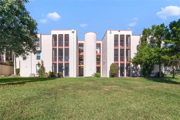 a view of a balcony with chair and table