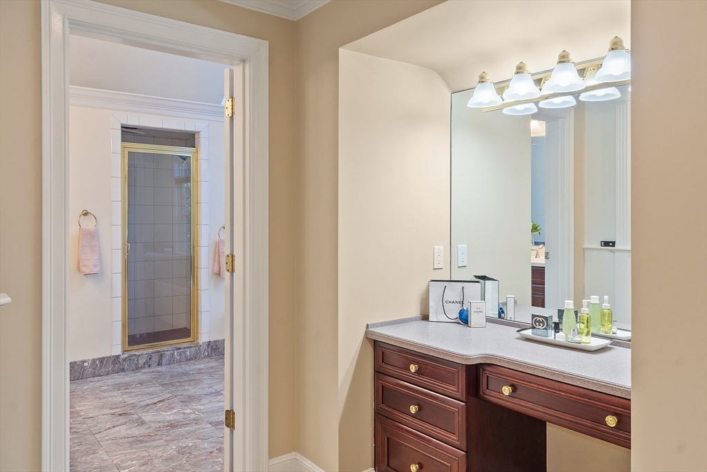 117 Hidden Road Andover, MA 01810 - Photo 27 of 42 a bathroom with a sink and a mirror