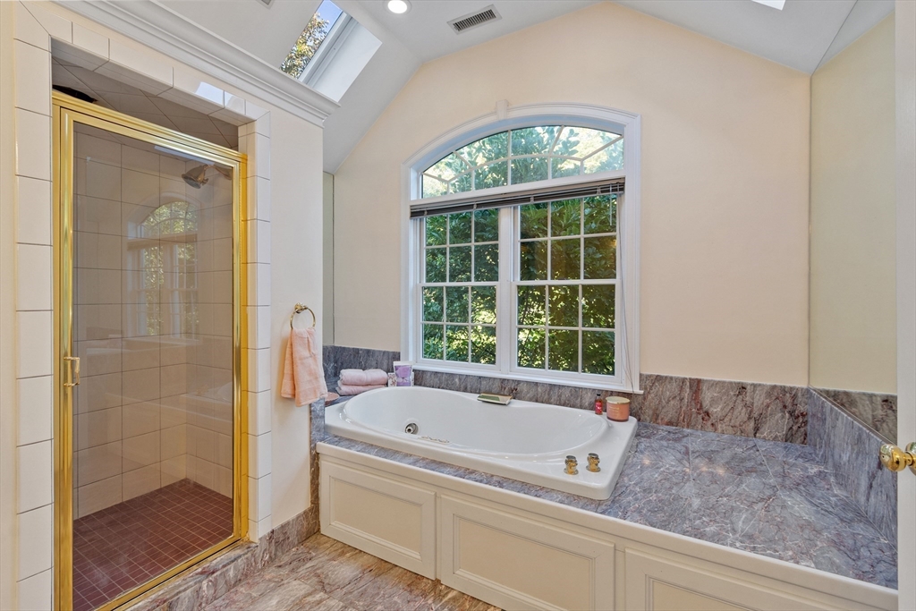 117 Hidden Road Andover, MA 01810 - Photo 28 of 42 a bathroom with a tub and a shower