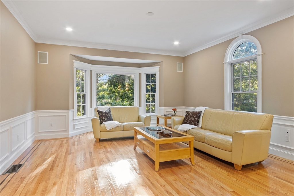 117 Hidden Road Andover, MA 01810 - Photo 10 of 42 a living room with furniture and a large window