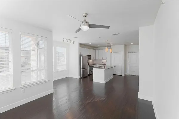 a view of kitchen with furniture and wooden floor